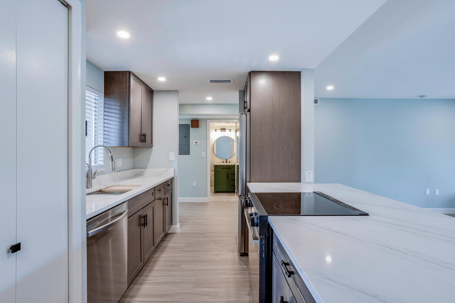 Bright modern kitchen and living area after Whiskey Creek Fort Myers condo remodel by Olde Florida Contracting